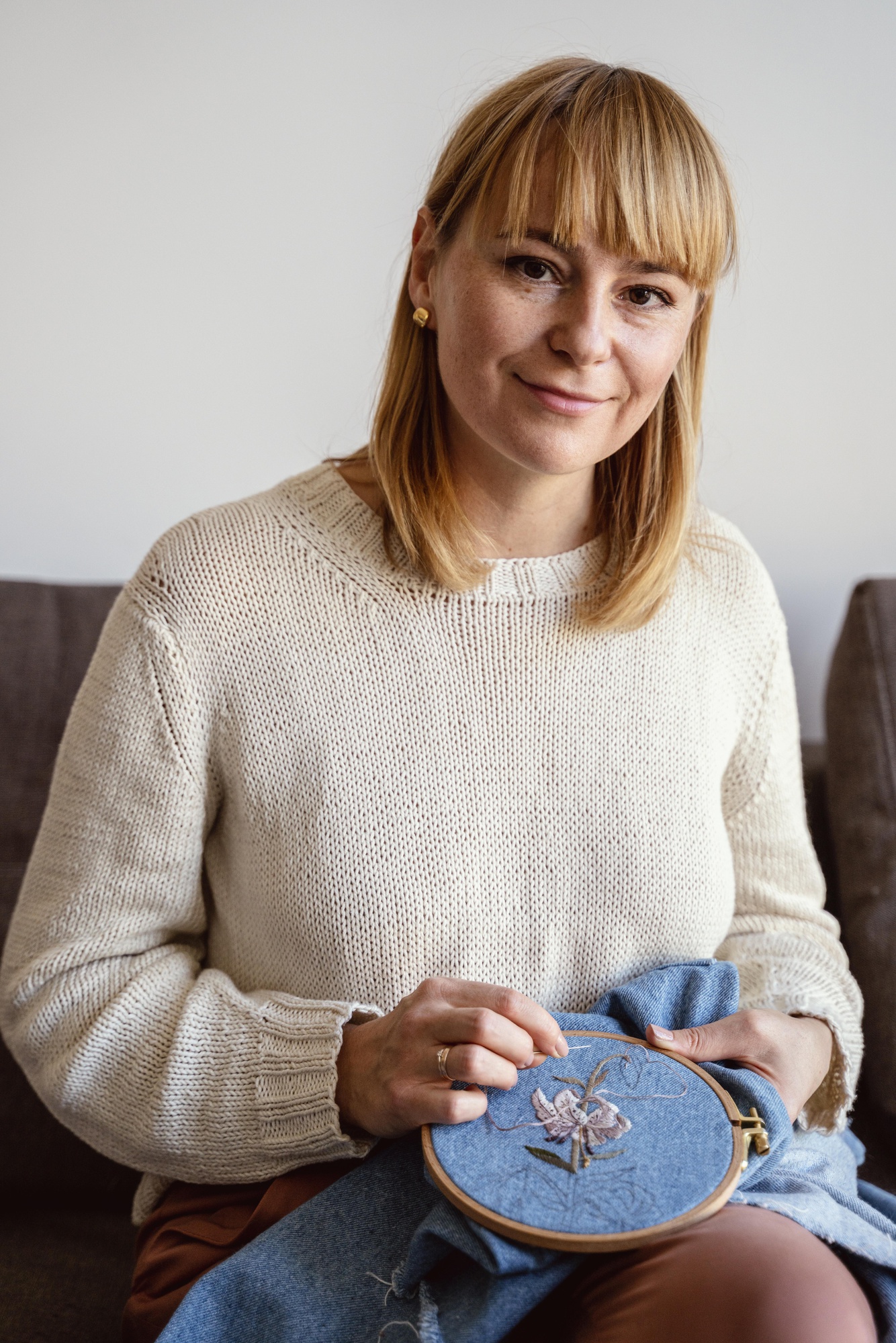 Portrait of lead embroiderer at work